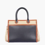 Elegant black handbag showing spacious interior and organized compartments