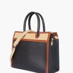 Black vintage handbag with structured design and premium faux leather finish